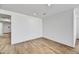 Bright living room featuring wood-look tile flooring and recessed lighting at 18950 W Stella Ave, Waddell, AZ 85355