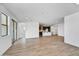 Open living room with tile floors and access to the kitchen and sliding door to the patio at 18950 W Stella Ave, Waddell, AZ 85355