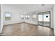 Open living room featuring tile floors, recessed lights, and a sliding glass door to the patio at 18950 W Stella Ave, Waddell, AZ 85355