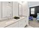 Bright bathroom with dual sinks, quartz countertops, and large mirrors at 19407 W Pierson St, Litchfield Park, AZ 85340