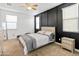 Bedroom showcasing a neutral color scheme with carpet and dark accent wall at 19407 W Pierson St, Litchfield Park, AZ 85340