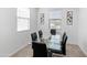 Dining room showcasing a glass table with black chairs at 19407 W Pierson St, Litchfield Park, AZ 85340