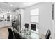 Dining area featuring modern table and kitchen view at 19407 W Pierson St, Litchfield Park, AZ 85340