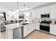 Modern kitchen with stainless steel appliances and large island at 19407 W Pierson St, Litchfield Park, AZ 85340