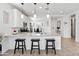 Bright kitchen featuring white cabinets, stainless steel appliances, and pendant lighting at 19407 W Pierson St, Litchfield Park, AZ 85340