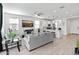 Bright open-concept living space with kitchen, lounge and backyard view at 19407 W Pierson St, Litchfield Park, AZ 85340
