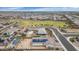 Aerial view capturing a meticulously planned community with a central park, landscaped streets, and houses with solar panels at 19806 W Marshall Ave, Litchfield Park, AZ 85340