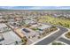 Aerial shot showcases a home with a pool, desert landscaping, and community green spaces at 19806 W Marshall Ave, Litchfield Park, AZ 85340