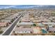 Sweeping aerial view of a residential neighborhood nestled amongst rolling hills, showcasing diverse homes and well-maintained streets at 19806 W Marshall Ave, Litchfield Park, AZ 85340