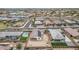 High angle aerial of a vibrant neighborhood, showcasing houses with solar panels, swimming pools, and community landscaping at 19806 W Marshall Ave, Litchfield Park, AZ 85340