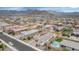 An aerial view of a home with a backyard pool and mountain views at 19806 W Marshall Ave, Litchfield Park, AZ 85340