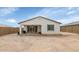 The backyard features a covered patio ideal for enjoying the outdoors, though currently with sparse landscaping at 19806 W Marshall Ave, Litchfield Park, AZ 85340
