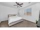 Bright bedroom featuring a cozy bed, neutral decor, and a large window for ample natural light at 19806 W Marshall Ave, Litchfield Park, AZ 85340