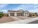 Charming single-story home featuring a two-car garage, desert landscaping, and a tile roof at 19806 W Marshall Ave, Litchfield Park, AZ 85340