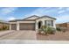 Beautiful single-story home with desert landscaping, a two-car garage, and attractive architectural details at 19806 W Marshall Ave, Litchfield Park, AZ 85340