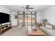 Bright living room with large sliding glass doors leading to the outdoor patio at 19806 W Marshall Ave, Litchfield Park, AZ 85340