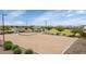 Community sand volleyball court with shaded seating at 19806 W Marshall Ave, Litchfield Park, AZ 85340