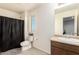 Bathroom featuring vanity, toilet and shower with curtain at 21648 W Ashleigh Marie St, Buckeye, AZ 85326