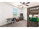 Bedroom featuring desk, bunk beds and view out window at 21648 W Ashleigh Marie St, Buckeye, AZ 85326