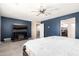 Cozy bedroom featuring carpeted floors, a fan, and a window allowing natural light at 21648 W Ashleigh Marie St, Buckeye, AZ 85326