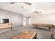 Spacious bonus room with dual ceiling fans, carpeted floors, and natural lighting at 21648 W Ashleigh Marie St, Buckeye, AZ 85326