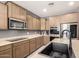 This kitchen includes generous cabinet space, stainless appliances, and plenty of room for meal prep at 21648 W Ashleigh Marie St, Buckeye, AZ 85326