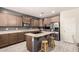 Kitchen boasts ample counter space, a large island, and stainless steel appliances, perfect for cooking at 21648 W Ashleigh Marie St, Buckeye, AZ 85326
