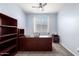 Office space with carpeted floors, neutral walls and a dark wood desk at 21648 W Ashleigh Marie St, Buckeye, AZ 85326