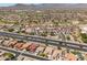 Picturesque community featuring mature landscaping, a golf course, and mountain views at 22926 W Yavapai St, Buckeye, AZ 85326