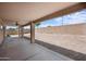 Spacious backyard with a large covered patio and gravel landscaping at 22926 W Yavapai St, Buckeye, AZ 85326