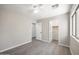 Bedroom featuring hardwood floors, ceiling fan, and a closet at 22926 W Yavapai St, Buckeye, AZ 85326