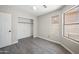Bedroom featuring hardwood floors, ceiling fan, natural light and closet at 22926 W Yavapai St, Buckeye, AZ 85326