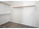 Walk-in closet featuring wood-look flooring and shelving and racks at 22926 W Yavapai St, Buckeye, AZ 85326