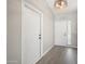 Bright foyer with wood-look flooring, white walls, and decorative lighting at 22926 W Yavapai St, Buckeye, AZ 85326