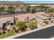 Charming single-story home with desert landscaping, mature trees, and a tile roof at 22926 W Yavapai St, Buckeye, AZ 85326