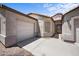 The exterior showcases a driveway leading to a garage and entry, featuring desert landscaping at 22926 W Yavapai St, Buckeye, AZ 85326