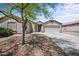 Charming single-story home featuring a well-maintained yard with a spacious driveway and three car garage at 22926 W Yavapai St, Buckeye, AZ 85326