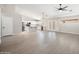 Expansive living area featuring light wood-look floors, vaulted ceilings, and an open layout at 22926 W Yavapai St, Buckeye, AZ 85326