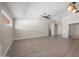 A spacious living area with light wood-look flooring, and neutral paint throughout at 22926 W Yavapai St, Buckeye, AZ 85326