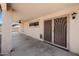 Covered patio area featuring ceiling fan and secured door at 22926 W Yavapai St, Buckeye, AZ 85326