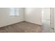 Neutral bedroom features gray carpet, white walls, and a window with blinds at 25138 W Chanute Pass, Buckeye, AZ 85326