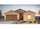 Charming single-story home with a two-car garage, desert landscaping, and stucco exterior at 25138 W Chanute Pass, Buckeye, AZ 85326