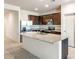 Well-equipped kitchen featuring granite countertops, stainless steel appliances, and ample cabinet space at 25138 W Chanute Pass, Buckeye, AZ 85326