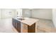 Kitchen island with stainless steel dishwasher, granite countertops, and plenty of cabinet space at 25138 W Chanute Pass, Buckeye, AZ 85326