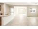 Bright, open-concept living area featuring tile floors and natural light at 25200 W Wier Ave, Buckeye, AZ 85326