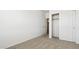 Comfortable carpeted bedroom with closet and open doorway to hallway at 25235 N 183Rd Dr, Wittmann, AZ 85361