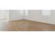 Bright bedroom with wood-look tile flooring, perfect for a minimalist design at 25235 N 183Rd Dr, Wittmann, AZ 85361