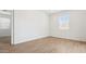 Bedroom features bright sunlight with tiled flooring and white trim at 25235 N 183Rd Dr, Wittmann, AZ 85361
