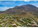 Aerial view of the community with mountain views and lush desert landscape at 25555 N Windy Walk Dr # 64, Scottsdale, AZ 85255
