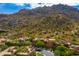 Aerial view of community with large mountains and lush desert landscape at 25555 N Windy Walk Dr # 64, Scottsdale, AZ 85255